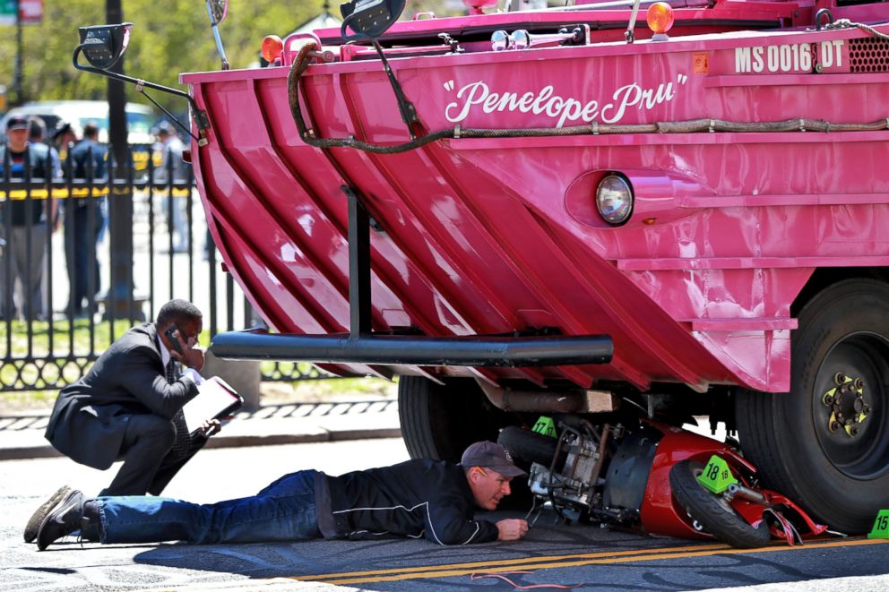 PHOTO: Investigators work the scene of an accident involving a Duck Boat, April 30, 2016, in Boston. A woman was killed after the scooter she was driving was struck by an amphibious sightseeing vehicle in downtown Boston.