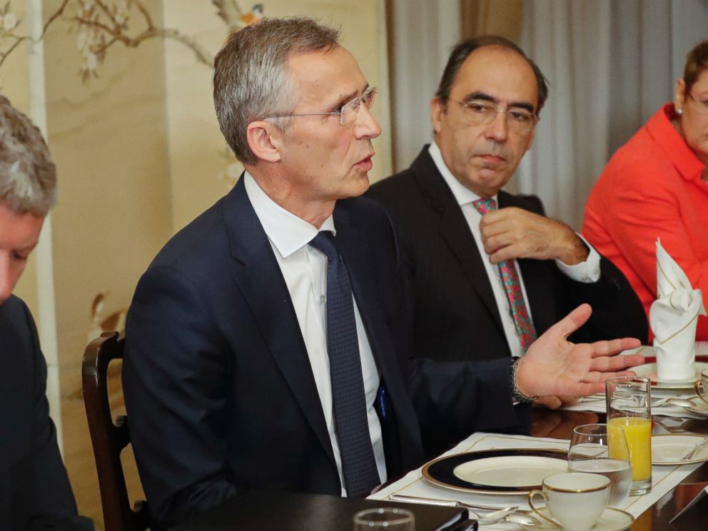 NATO Secretary General Jens Stoltenberg, gestures while speaking to U.S. President Donald Trump during their bilateral breakfast, Wednesday, July 11, 2018 in Brussels, Belgium. 