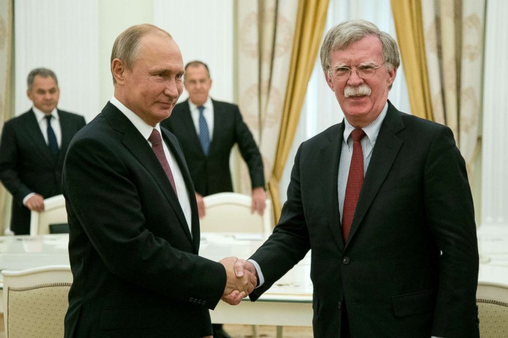 PHOTO: Russian President Vladimir Putin, left, shakes hands with US National security adviser John Bolton during their meeting in Moscow, June 27, 2018.