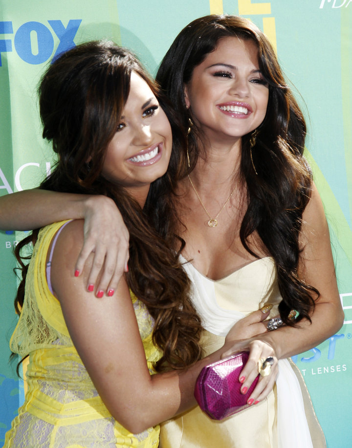 Demi Lovato and Selena Gomez pose together at the 2011 Teen Choice Awards.