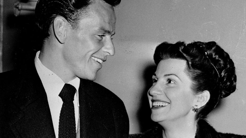 In this Oct. 23, 1946 file photo, singer Frank Sinatra and his wife Nancy smile broadly as they leave a Hollywood night club following a surprise meeting.