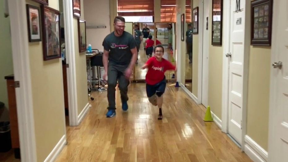 Quad amputee Moshe runs for the very first time, thanks to state-of-the-art prosthetics).