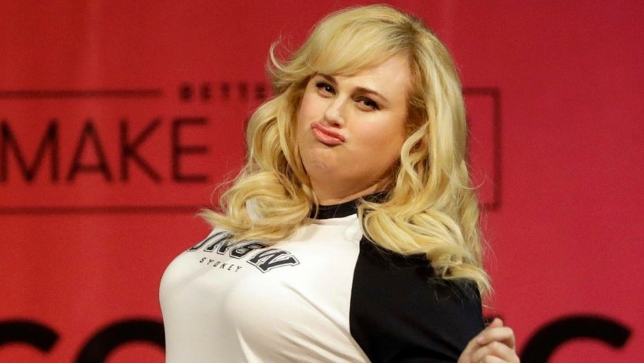 In this May 2, 2018, file photo, actress Rebel Wilson struts across the stage as she is introduced to speak at College Signing Day, an event honoring Philadelphia students for their pursuit of a college education or career in the military at Temple University in Philadelphia. Wilson has applied to Australia's highest court to increase the comic actress's payout from a defamation case against a magazine publisher. 
