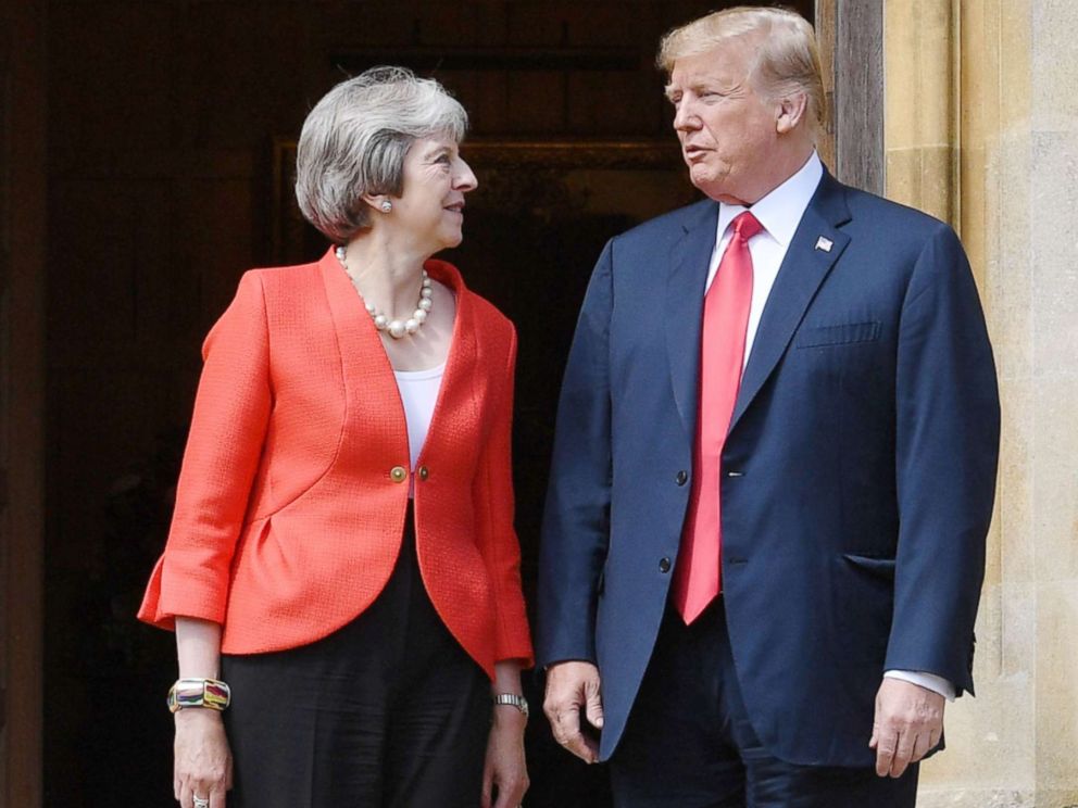 PHOTO: President Donald Trump and Britains Prime Minister Theresa May stand together upon Trumps arrival for a meeting at Chequers, the prime ministers country residence, near Ellesborough, northwest of London, July 13, 2018.