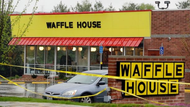 Police tape blocks off a Waffle House restaurant Sunday, April 22, 2018, in Nashville, Tenn. At least four people died after a gunman opened fire at the restaurant early Sunday.(AP Photo/Mark Humphrey)