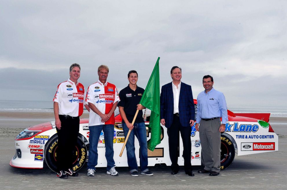 PHOTO: In this file photo, Len Wood, Eddie Wood, Joie Chitwood, Trevor Bayne and Brian France near the beach course famous North Turn prior to Trevor Bayne driving the car to the Daytona International Speedway, Feb. 19, 2012, in Daytona Beach, Fla.