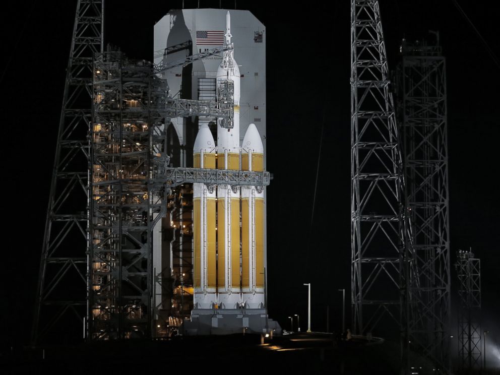 PHOTO: The service structure is rolled away from NASAs Orion spaceship, Dec. 4, 2014, in Cape Canaveral, Fla.