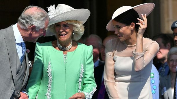 Meghan, Duchess of Sussex attends a garden party at Buckingham Palace, with Camilla the Duchess of Cornwall and Prince Charles, in London, Britain May 22, 2018.  Dominic Lipinski/Pool via Reuters - RC158DAC26A0
