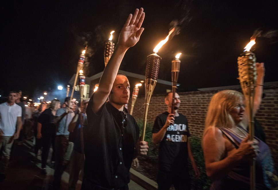 White nationalists and white supremacists carrying torches march through the University of Virginia campus on Aug. 11, 2017.
