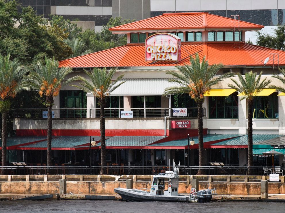 Law enforcement boats patrol the St. Johns River at The Jacksonville Landing after a mass shooting during a video game tournament at the riverfront mall, Sunday, Aug. 26, 2018, in Jacksonville, Fla. (Will Dickey/The Florida Times-Union via AP)