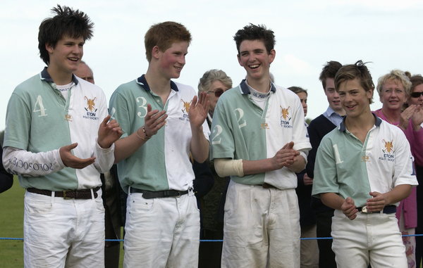 Prince Harry with his teammates from the Eton Polo Society smiling and applauding the opposing team, the Cheltenham College P