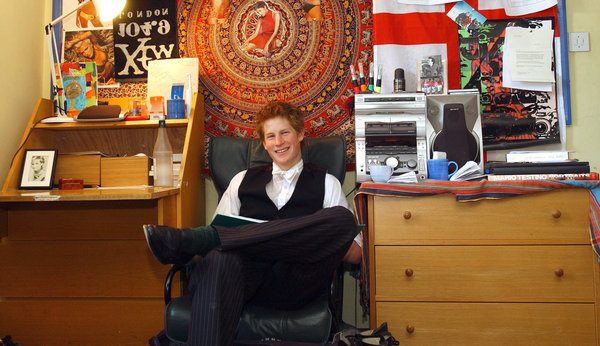 Prince Harry sits in his bedroom at Eton College.