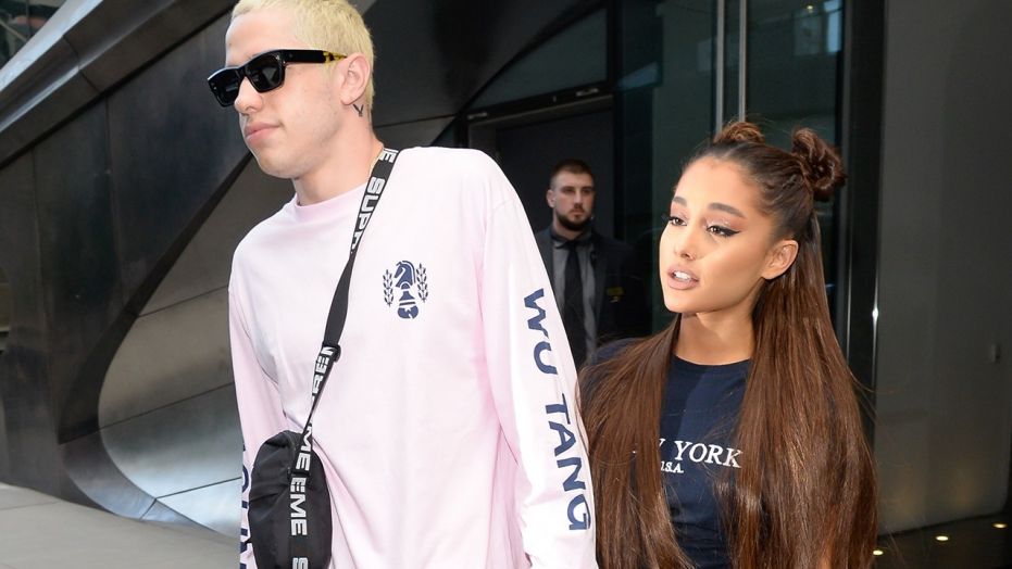 Ariana Grande, right, and Pete Davidson are seen walking in Midtown on July 11, 2018 in New York City.