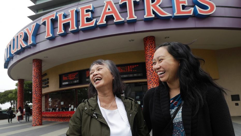 Alice Sue, left, and her daughter Audrey Sue-Matsumoto laugh while interviewed after watching the movie "Crazy Rich Asians" in Daly City, Calif., Aug. 23, 2018.