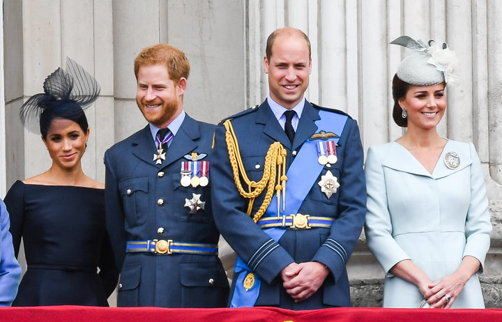 The Duke and Duchess of Sussex stand alongside the Duke and Duchess of Cambridge on the balcony of Buckingham Palace on July 