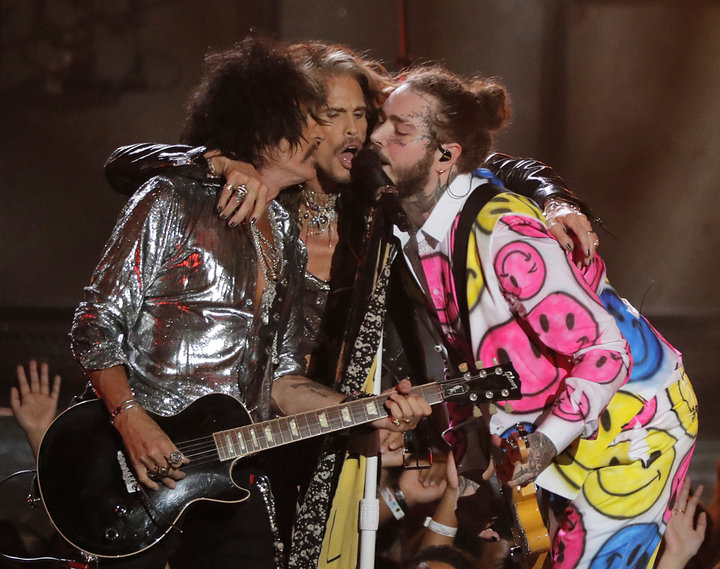 Post Malone performs with Joe Perry and Steven Tyler during the MTV Video Music Awards on Monday.