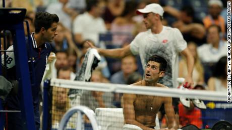 Novak Djokovic stayed in court while John Millman of Australia left the pitch to change his shirt due to the humidity during a US Open Men&#39;s singles quarter-finals match on Wednesday.