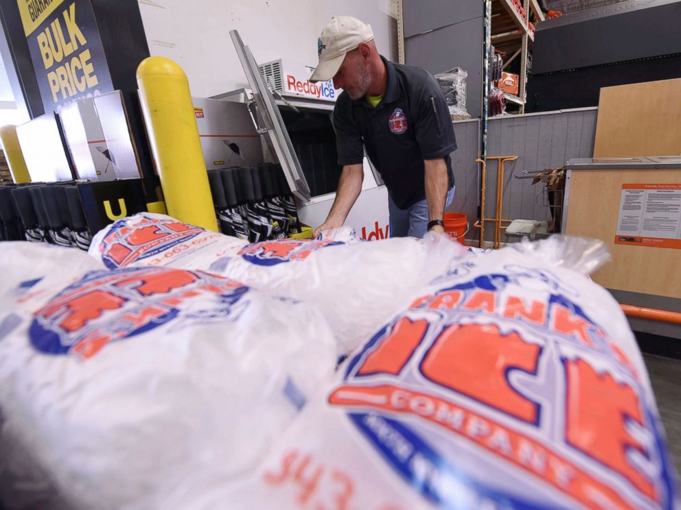 PHOTO: Mike Herring with Franks Ice Company unloads another pallet of ice as people buy supplies at The Home Depot on Monday, Sept. 10, 2018, in Wilmington, N.C.