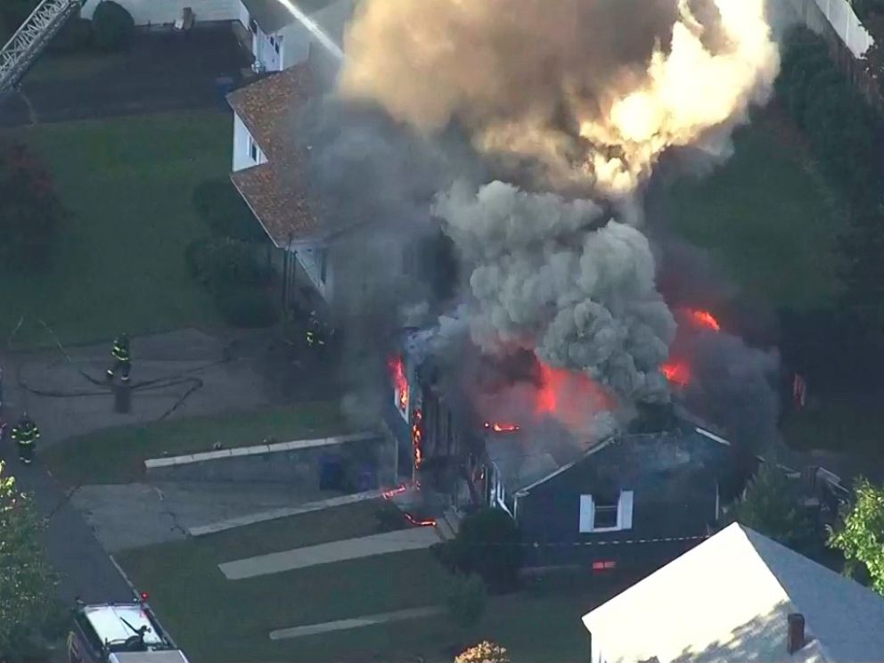 In this image take from video provided by WCVB in Boston, firefighters battle a raging house fire in Lawrence, Mass, a suburb of Boston, Thursday, Sept. 13, 2018. Emergency crews are responding to what they believe is a series of gas explosions that 