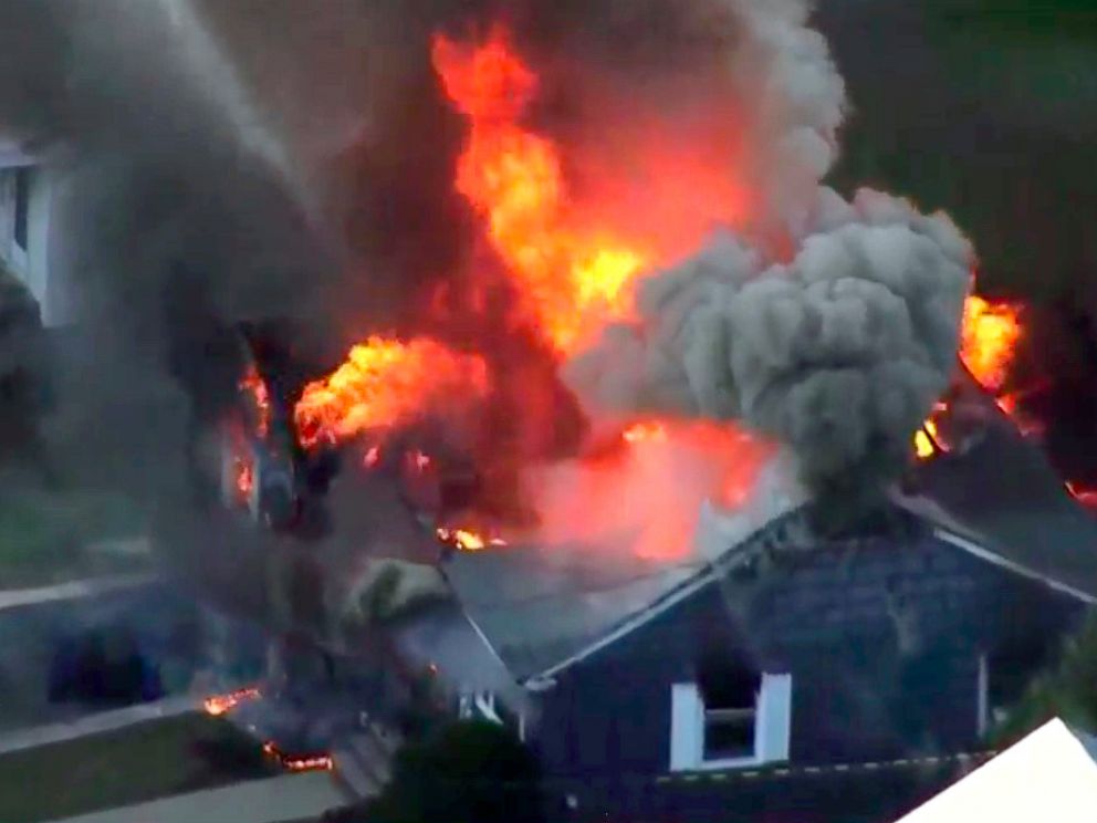 In this image take from video provided by WCVB in Boston, flames consume a home in Lawrence, Mass, a suburb of Boston, Thursday, Sept. 13, 2018. Emergency crews are responding to what they believe is a series of gas explosions that have damaged homes