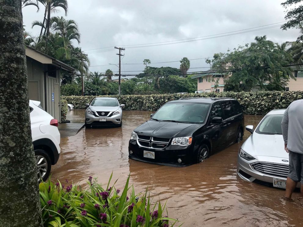 PHOTO: Water floods a parking lot at a condo complex near Kahana Village in Lahaina, Hawaii, Sept. 12, 2018.