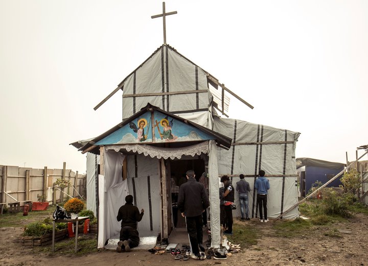 Ethiopian Coptic migrants arrive for a Mass at the makeshift Orthodox church in a migrant camp in Calais, northern France,&nb