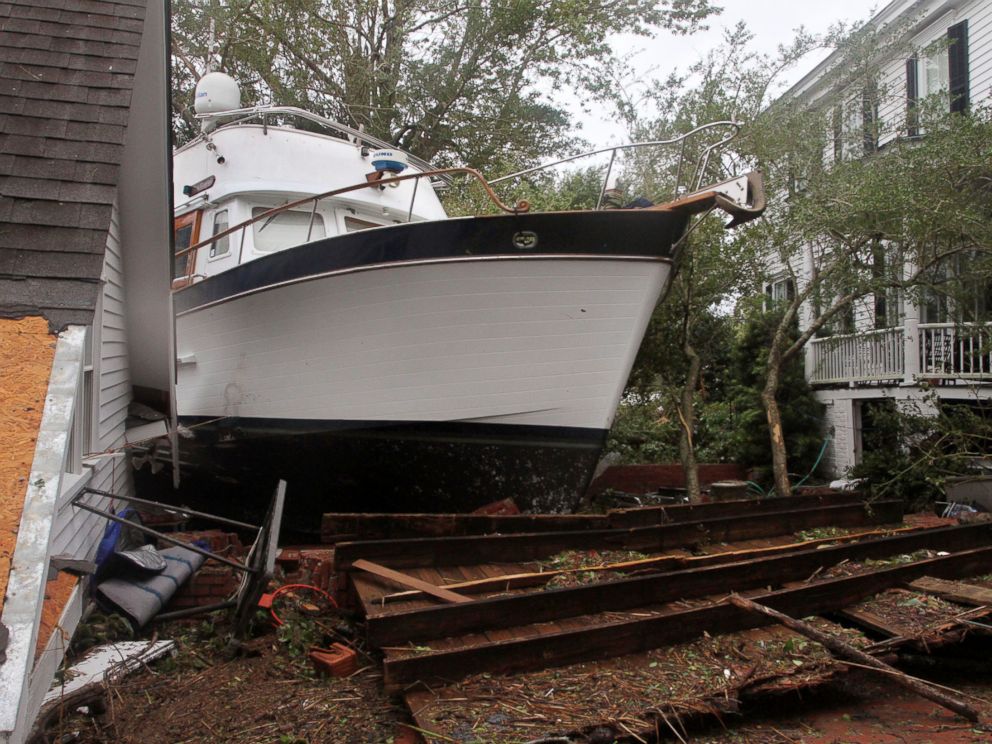 PHOTO: A 40-foot yacht lies in the yard of a storm-damaged home on East Front Street in New Bern, N.C., Saturday, Sept. 15, 2018. The boat washed up with storm surge and debris from Hurricane Florence.
