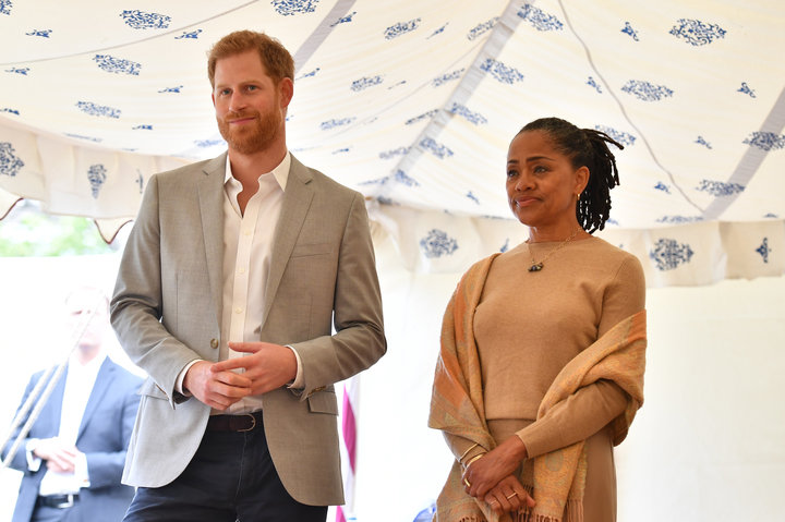 Prince Harry and Doria Ragland look on as the Duchess of Sussex speaks.&nbsp;