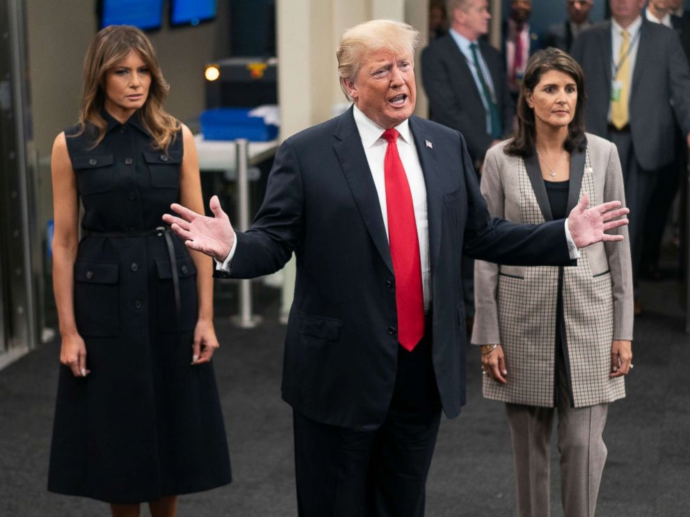PHOTO: President Donald Trump addresses members of the news media as he arrives with First lady Melania Trump, left, and Nikki Haley, the U.S. ambassador to the United Nations, Sept. 25, 2018.