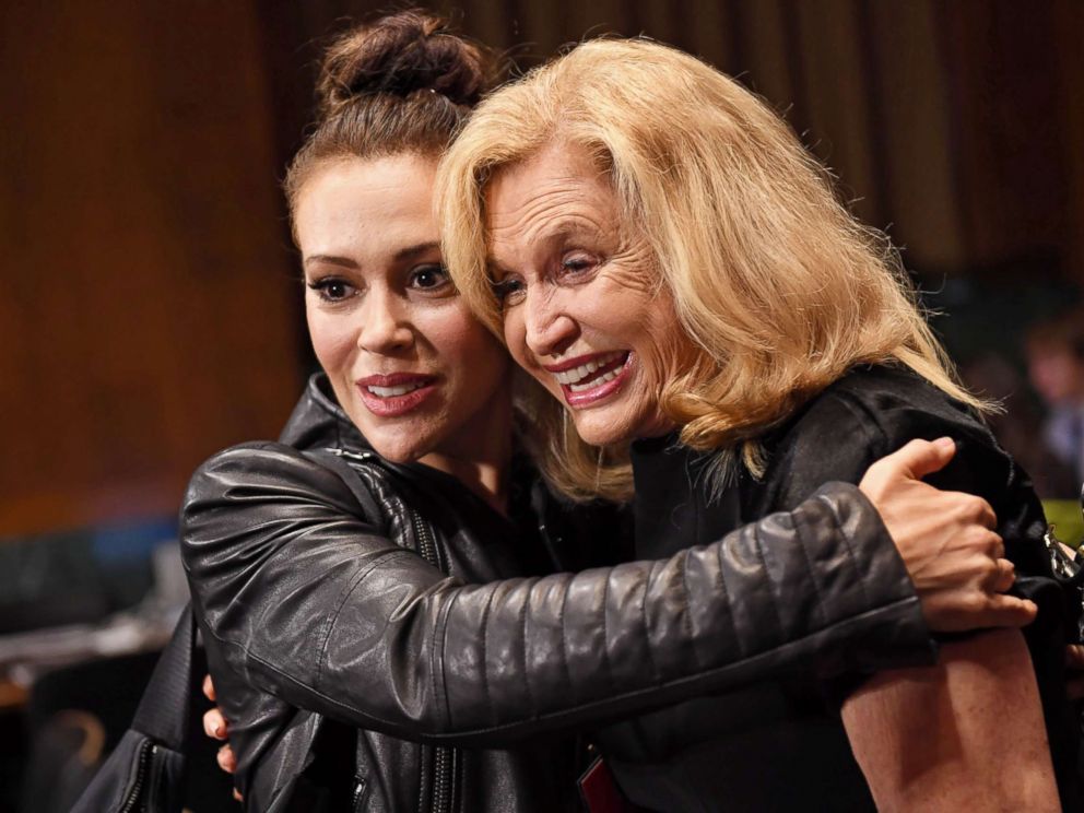 PHOTO: Actress Alyssa Milano hugs Rep. Carolyn Maloney in the hearing room prior to the Senate Judiciary Committee hearing on the nomination of Brett Kavanaugh on Capitol Hill in Washington, Sept. 27, 2018.