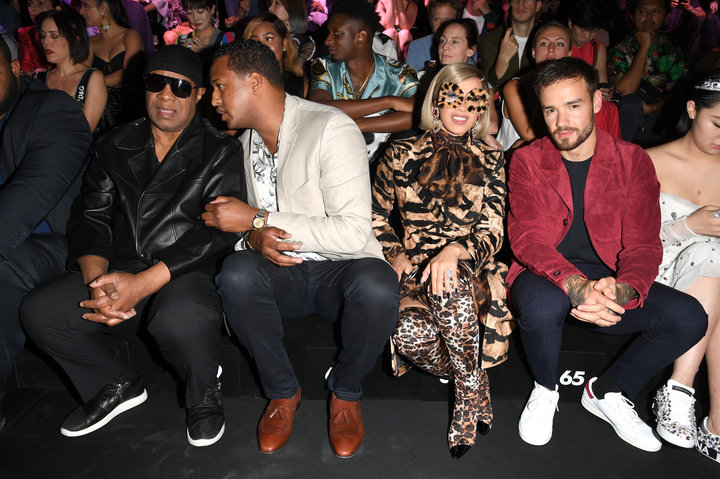 Cardi B and Liam Payne sitting next to each other at the show.&nbsp;