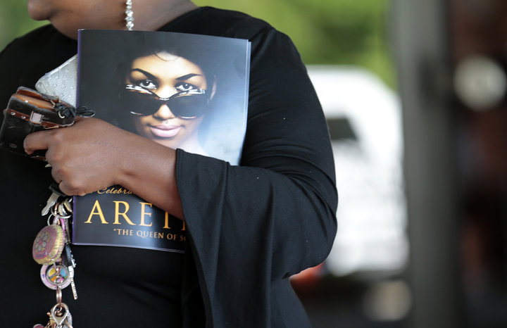 A woman holds a program from Aretha Franklin's funeral at the Greater Grace Temple on Friday in Detroit, Michigan.