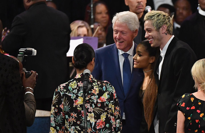 Former President Bill Clinton takes a picture with Grande and her fianc&eacute;e, Pete Davidson, before Franklin's funeral.