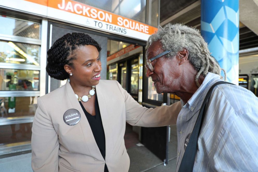 PHOTO: Boston City Councilor and congressional candidate Ayanna Pressley talks to Jeffrey McNary as she campaigns against Michael Capuano at the Jackson Square MBTA Station in the Jamaica Plain neighborhood of Boston on July 10, 2018.