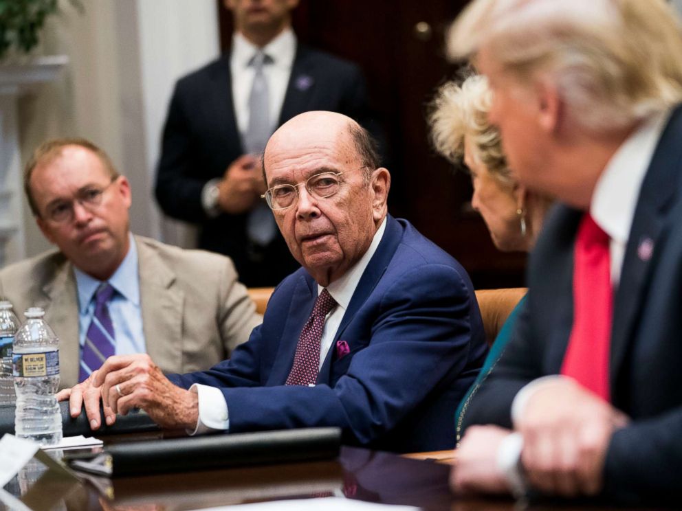 PHOTO: Commerce Secretary Wilbur Ross speaks to President Donald Trump during the first meeting of the Presidents National Council for the American Worker at the White House in Washington, Sept. 17, 2018.