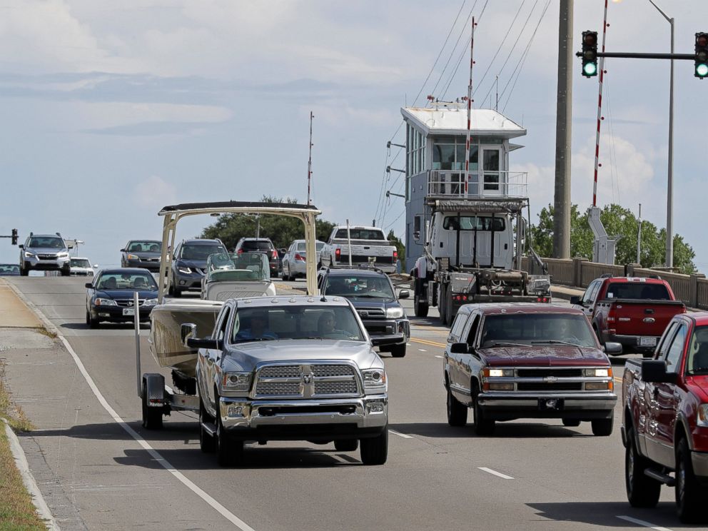 PHOTO: People drive over a drawbridge in Wrightsville Beach, N.C., as they evacuate the area in advance of Hurricane Florence, Tuesday, Sept. 11, 2018.