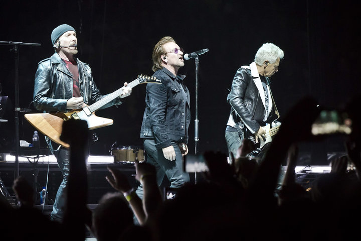 The Edge, Bono and Adam Clayton of the Irish band U2 performing in Berlin on Friday night.