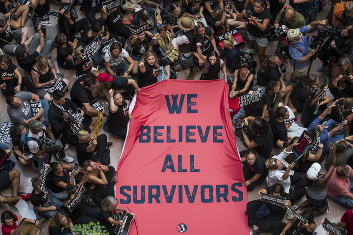 Protestors rally against Kavanaugh in the atrium of the Hart Senate Office Building on Capitol Hill on Oct. 4, 2018.