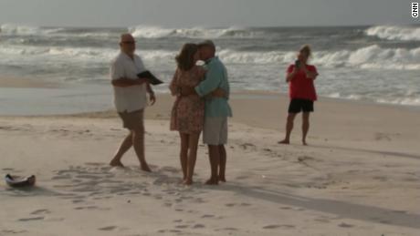 Cindy and Benny Guinn kiss at their wedding Tuesday morning in Panama City Beach, Florida.