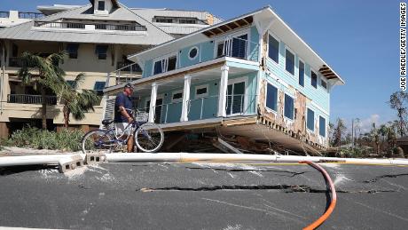 The hurricane carried a home across a road and slammed it against a condo complex in Mexico Beach.