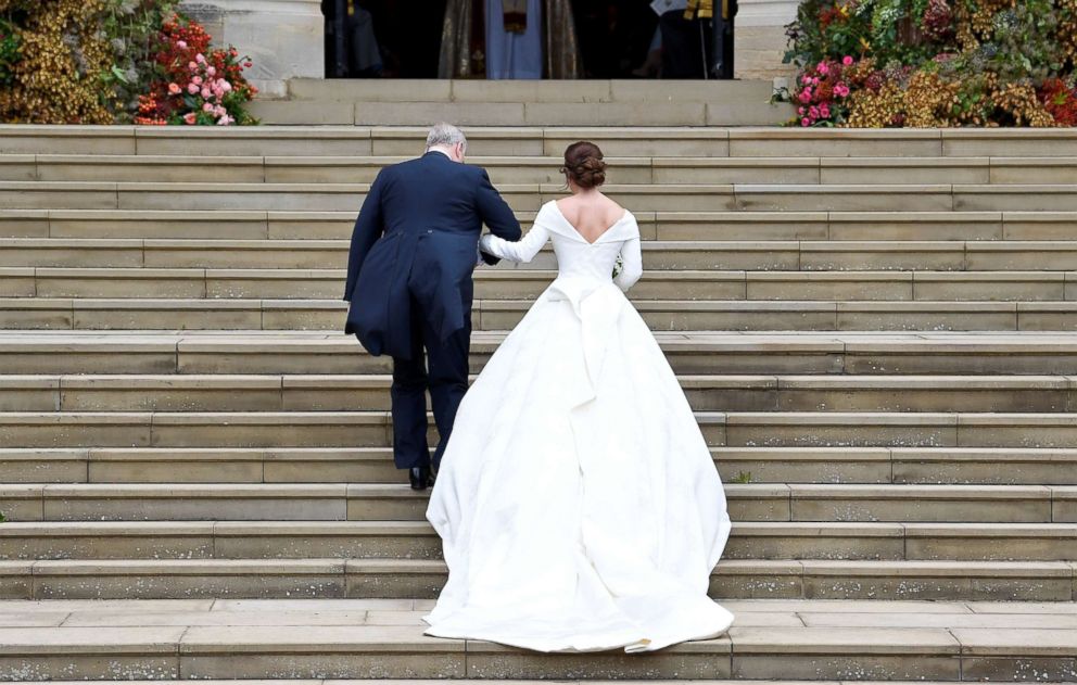 PHOTO: Britains Princess Eugenie arrives accompanied by her father Prince Andrew, Duke of York, at St Georges Chapel for her wedding to Jack Brooksbank in Windsor Castle, Oct. 12, 2018.