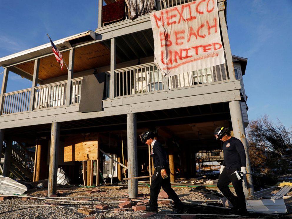 PHOTO: A banner hangs from a damaged home as a South Florida urban search and rescue team checks for survivors of hurricane Michael in Mexico Beach, Fla., Friday, Oct. 12, 2018.
