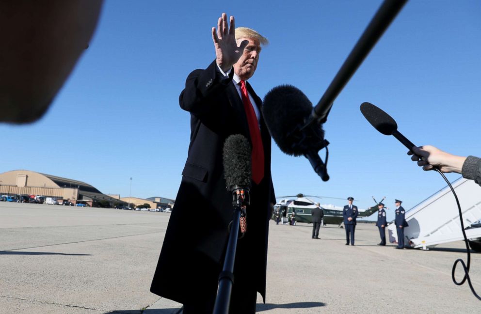 PHOTO: President Donald Trump waves off further questions as he heads to board Air Force One after talking to reporters about journalist Jamal Khashoggis disappearance while departing for travel to Montana from Joint Base Andrews, Md., Oct. 18, 2018.