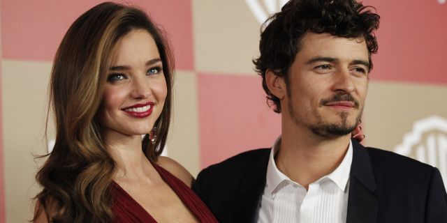 Actor Orlando Bloom (R) and model Miranda Kerr pose at the InStyle/Warner Bros. after party following the 70th annual Golden Globe Awards in Beverly Hills, California January 13, 2013. REUTERS/Mario Anzuoni (UNITED STATES - Tags: ENTERTAINMENT) (GOLDENGLOBES-PARTIES) - RTR3CFJY