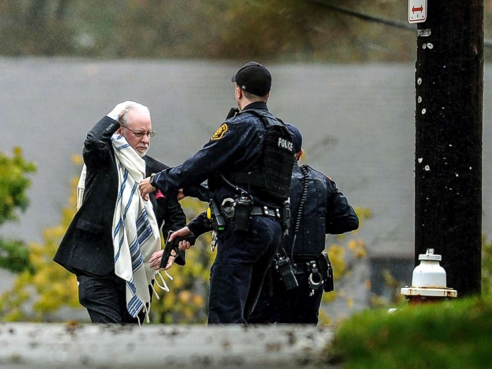 PHOTO: A man is escorted out of the Tree of Life Congregation by police following a shooting at the Pittsburg synagogue, Oct. 27, 2018.