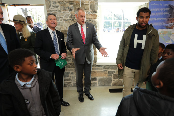 Zinke and Chip Akridge (standing to the left), founder of the Trust for the National Mall, tour the newly restored Old Canal 