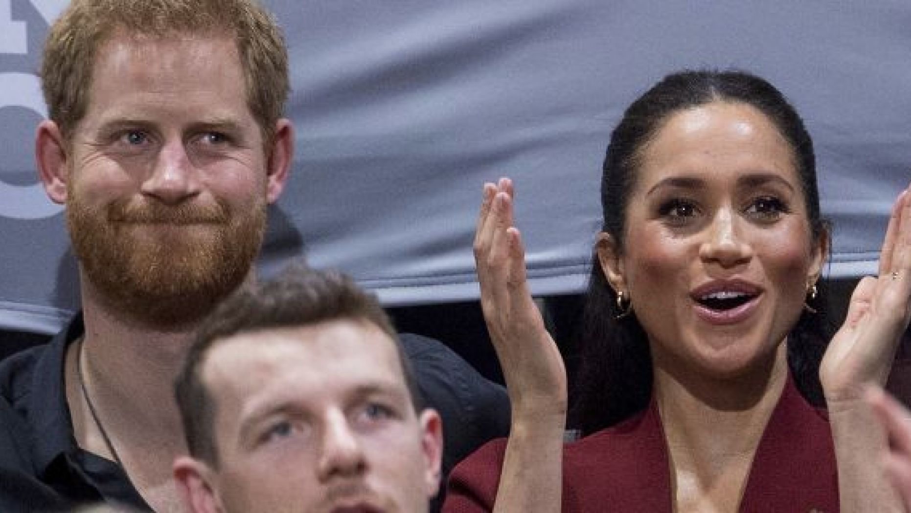 Britain's Prince Harry and Meghan, Duchess of Sussex applaud as they watch the wheelchair basketball final at The Invictus Games in Sydney, Australia, Saturday, Oct. 27, 2018. Prince Harry and his wife Meghan are on day twelve of their 16-day tour of Australia and the South Pacific. (AP Photo)