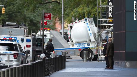 An NYPD bomb squad vehicle departs an area outside Time Warner Center on Wednesday, Oct. 24, 2018, in New York. Law enforcement officials say a suspicious package that prompted an evacuation of CNN&#39;s offices is believed to contain a pipe bomb. (AP Photo/Kevin Hagen)