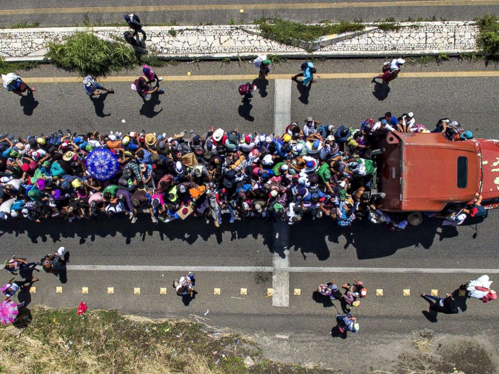 PHOTO: Aerial view of Honduran migrants on board a truck as they take part in a caravan heading to the U.S., in the outskirts of Tapachula, on their way to Huixtla, Chiapas state, Mexico, on Oct. 22, 2018. 