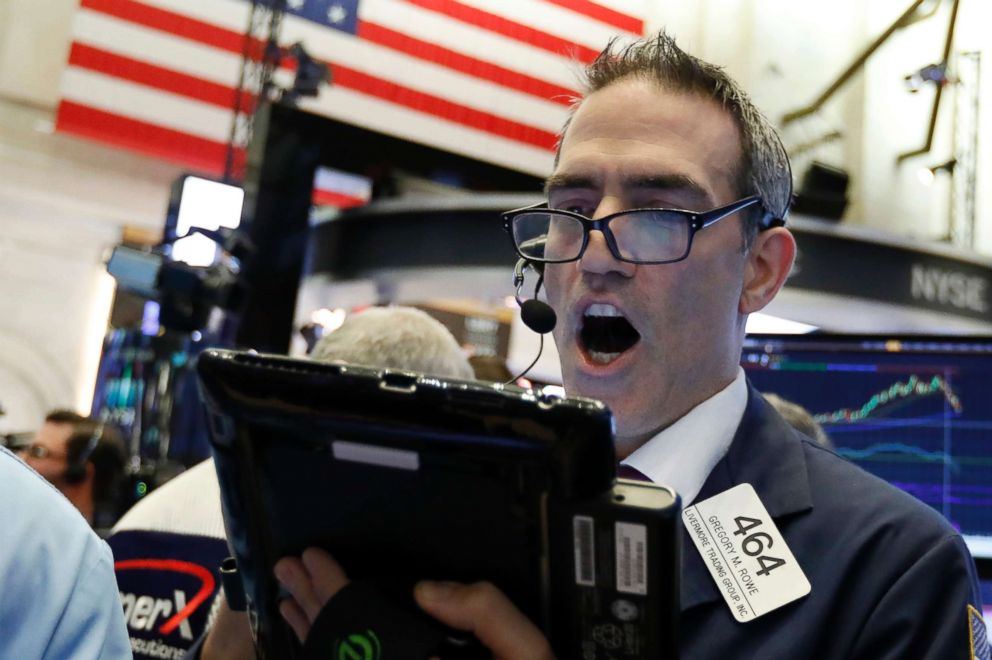 PHOTO: Trader Gregory Rowe works on the floor of the New York Stock Exchange, Oct. 23, 2018.